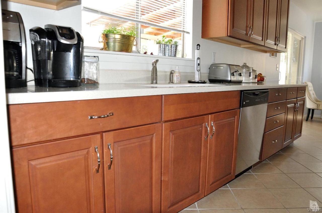 1072 Appleton Road Simi Valley, CA 93065 - Photo 15 of 41 a kitchen with stainless steel appliances granite countertop a sink stove and cabinets