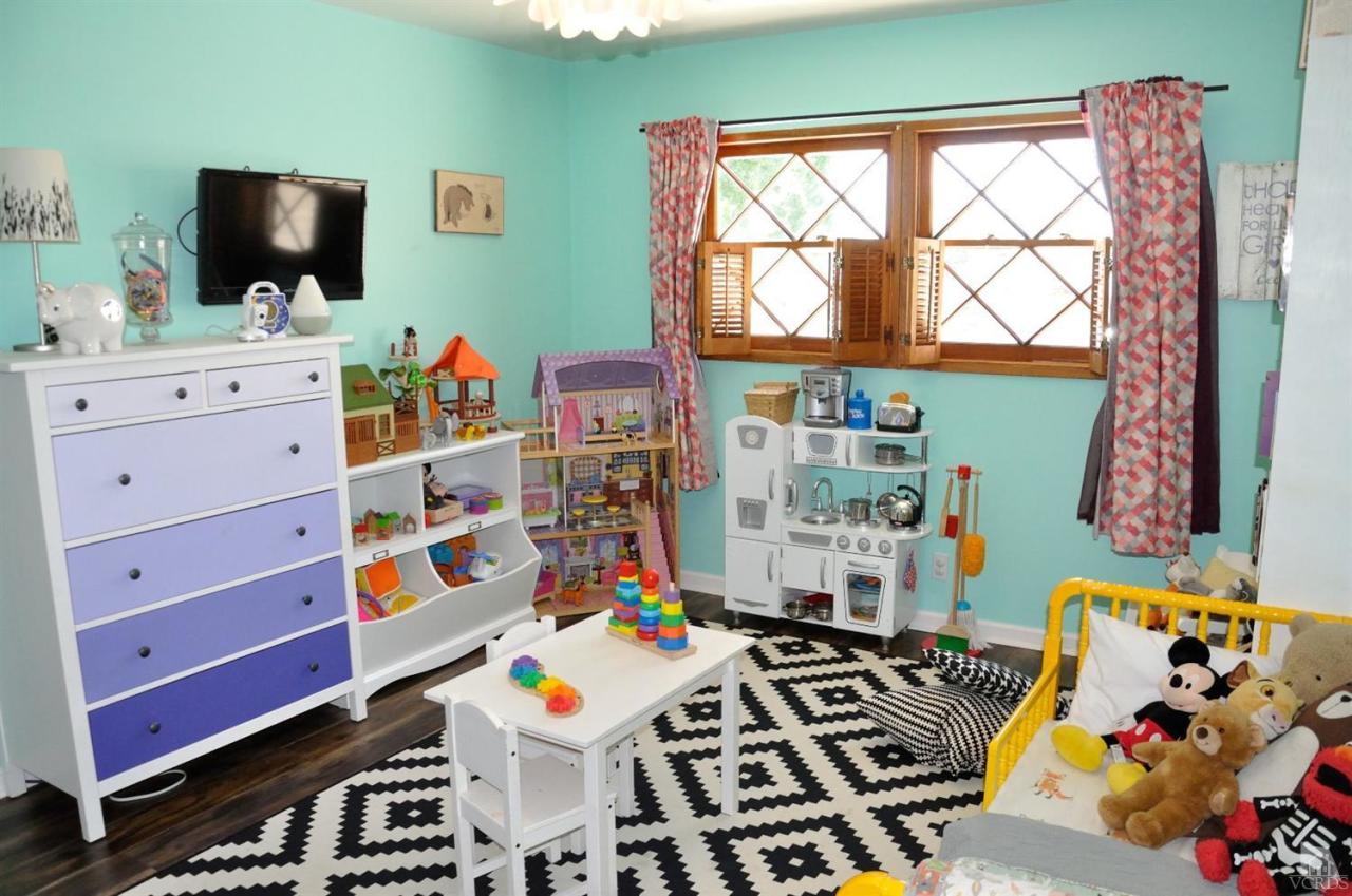 1072 Appleton Road Simi Valley, CA 93065 - Photo 19 of 41 a room with furniture a flat screen tv and a window