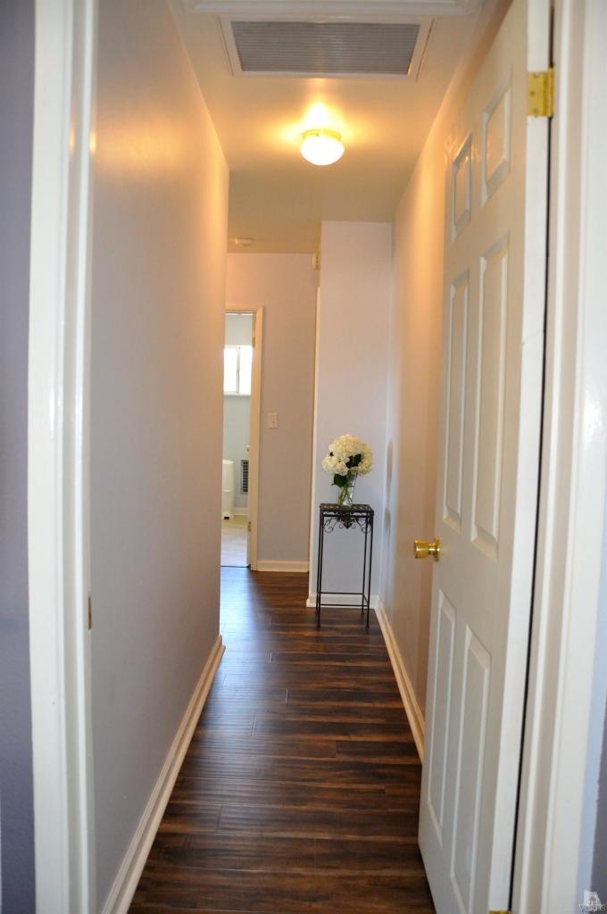 1072 Appleton Road Simi Valley, CA 93065 - Photo 20 of 41 a view of a hallway with wooden floor and staircase