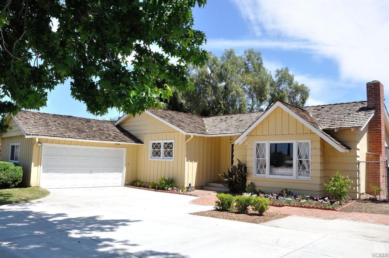 1072 Appleton Road Simi Valley, CA 93065 - Photo 3 of 41 a front view of a house with a yard