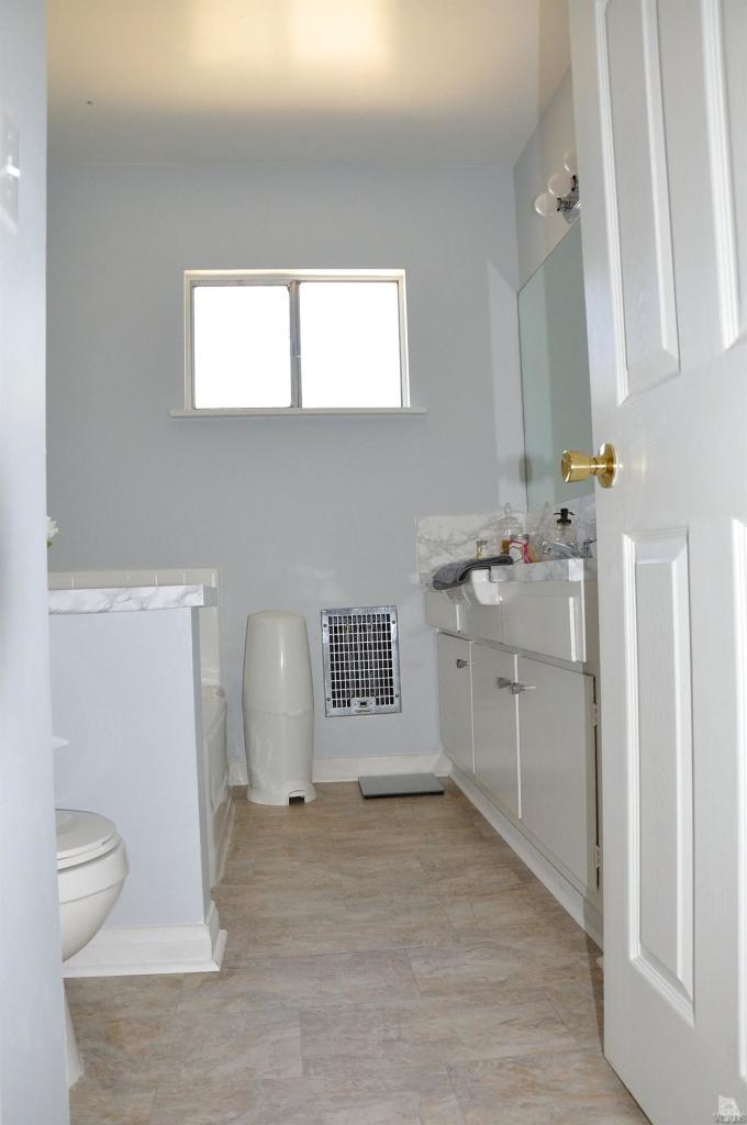 1072 Appleton Road Simi Valley, CA 93065 - Photo 21 of 41 a bathroom with a sink toilet and mirror