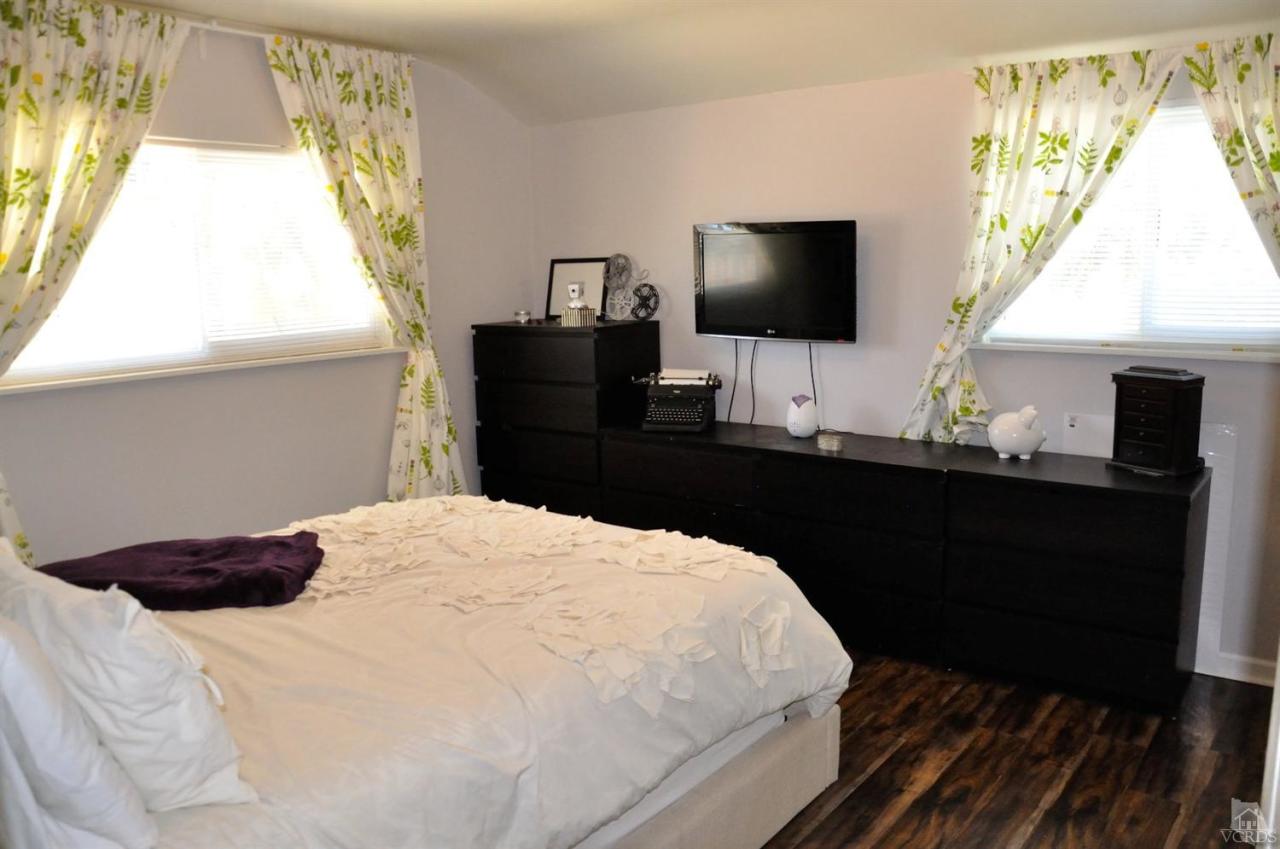 1072 Appleton Road Simi Valley, CA 93065 - Photo 27 of 41 a bedroom with a bed and a flat screen tv