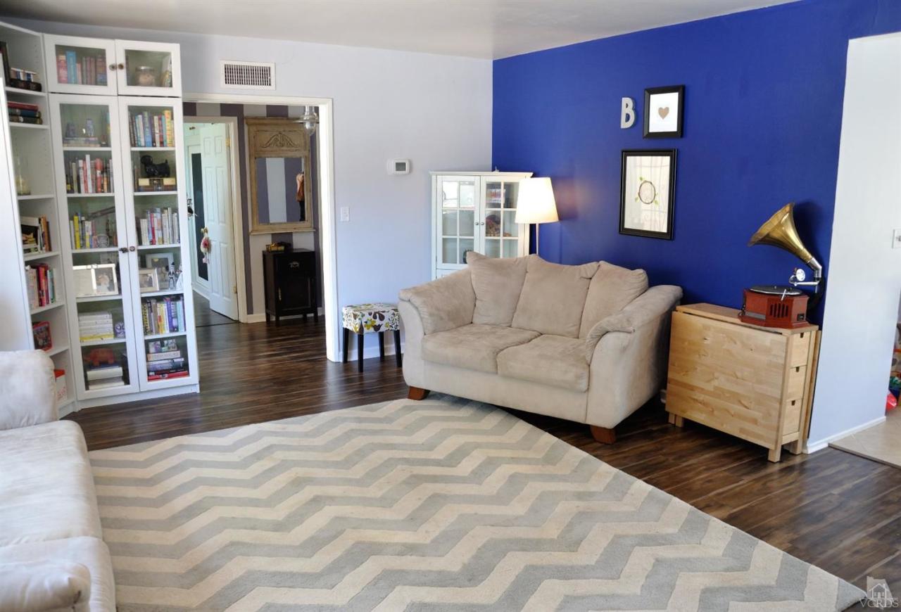1072 Appleton Road Simi Valley, CA 93065 - Photo 7 of 41 a bedroom with a large bed and a couch