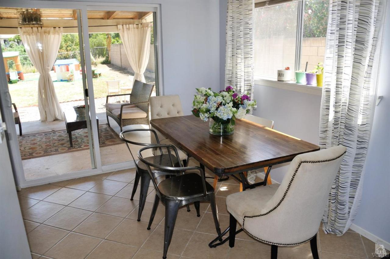 1072 Appleton Road Simi Valley, CA 93065 - Photo 9 of 41 a view of a dining room with furniture and a window
