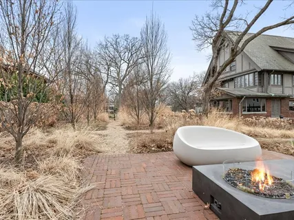 a large kitchen with stainless steel appliances a large counter top