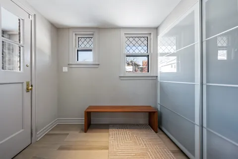 a view of entryway with wooden floor and stairs