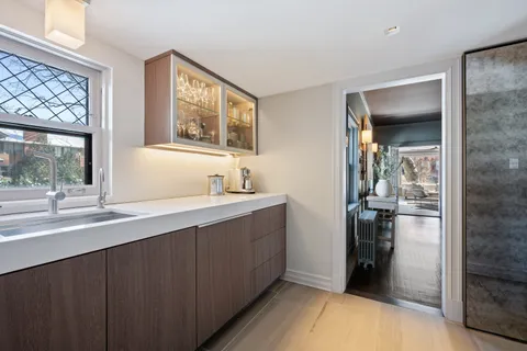 a bathroom with a sink and a walk in closet