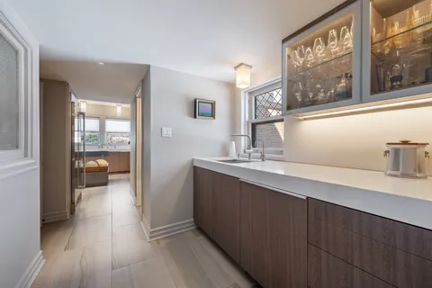 a spacious bedroom with a bed and wooden floor