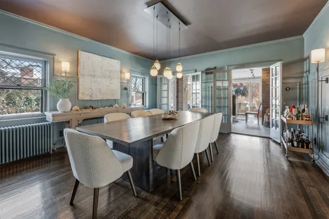 a living room with furniture and a floor to ceiling window or kitchen