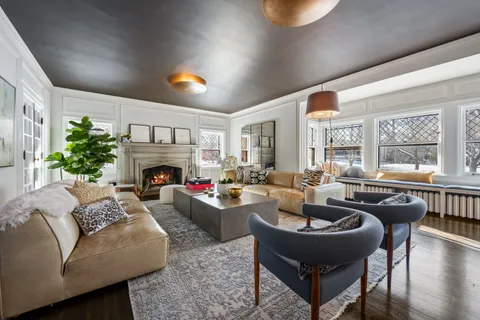 a living room with furniture and windows