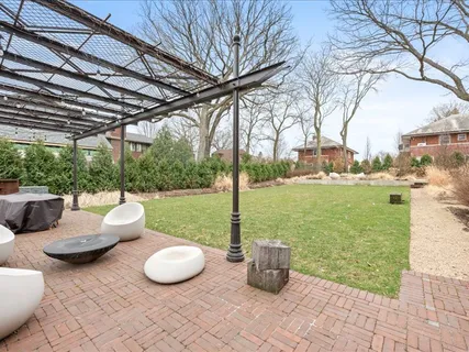 a view of a backyard with sitting area and fire pit