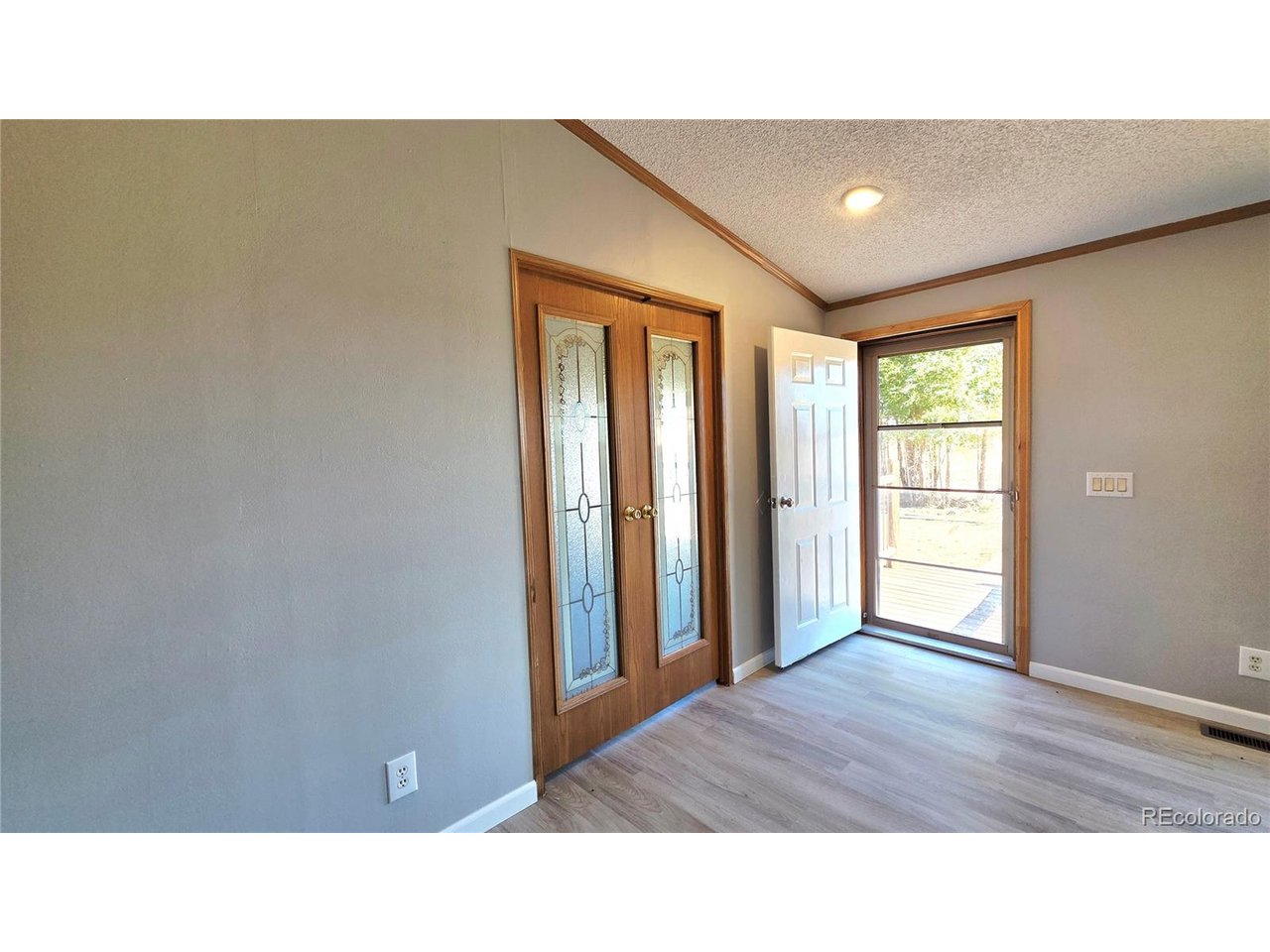 10754 County Road East Olney Springs, CO 81062 - Photo 14 of 49 a open hall with a hardwood floor