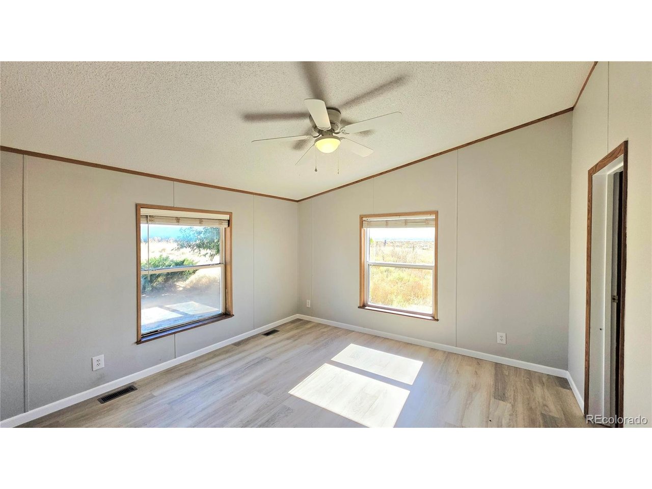 10754 County Road East Olney Springs, CO 81062 - Photo 20 of 49 a black and white photo of a living room