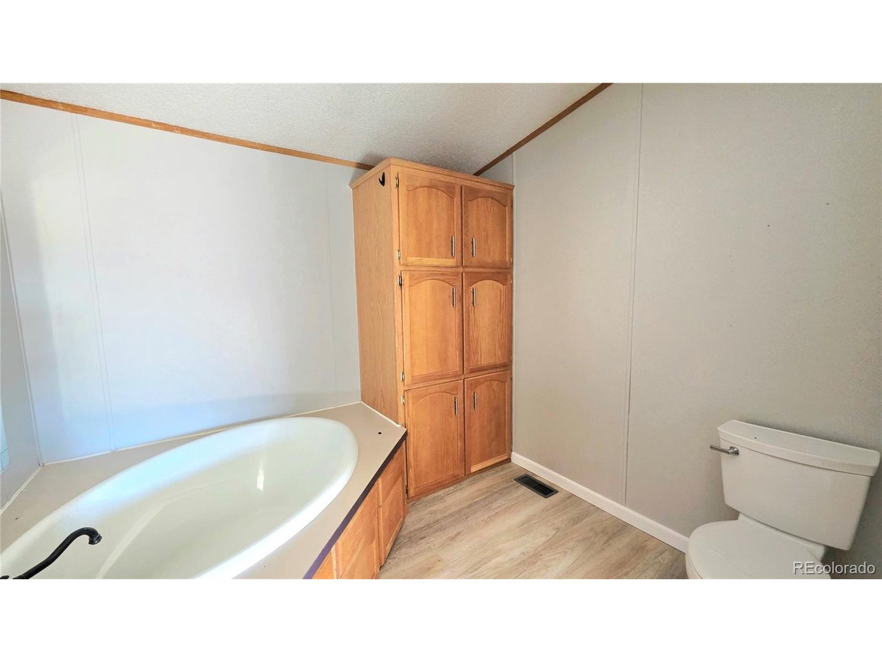 10754 County Road East Olney Springs, CO 81062 - Photo 23 of 49 a bathroom with a sink and a bathtub