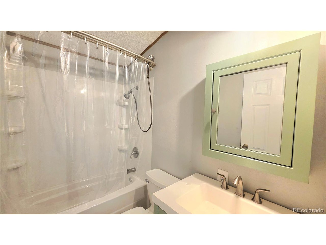 10754 County Road East Olney Springs, CO 81062 - Photo 31 of 49 a bathroom with a sink and a mirror