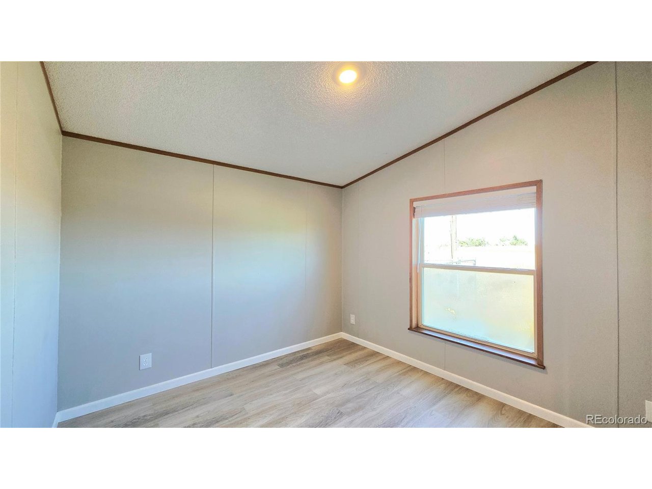 10754 County Road East Olney Springs, CO 81062 - Photo 33 of 49 a open living room with a wooden floor