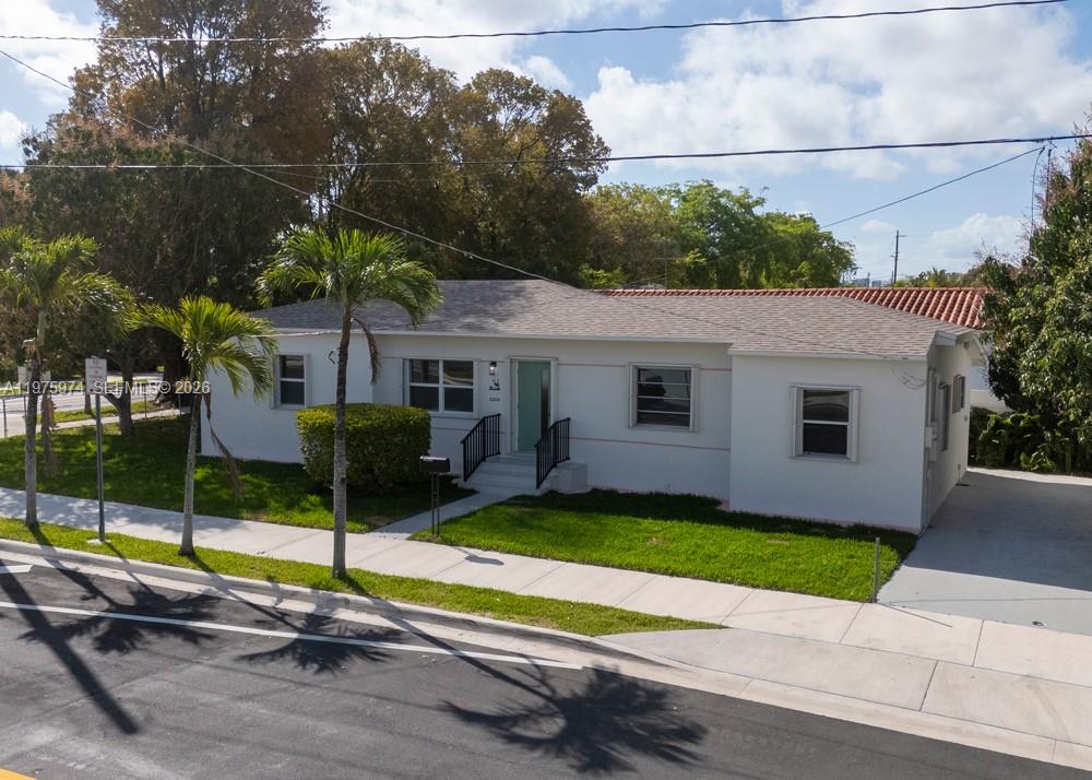3200 Southwest 2nd Street Miami, FL 33135 - Photo 2 of 10 a view of a house with backyard and porch