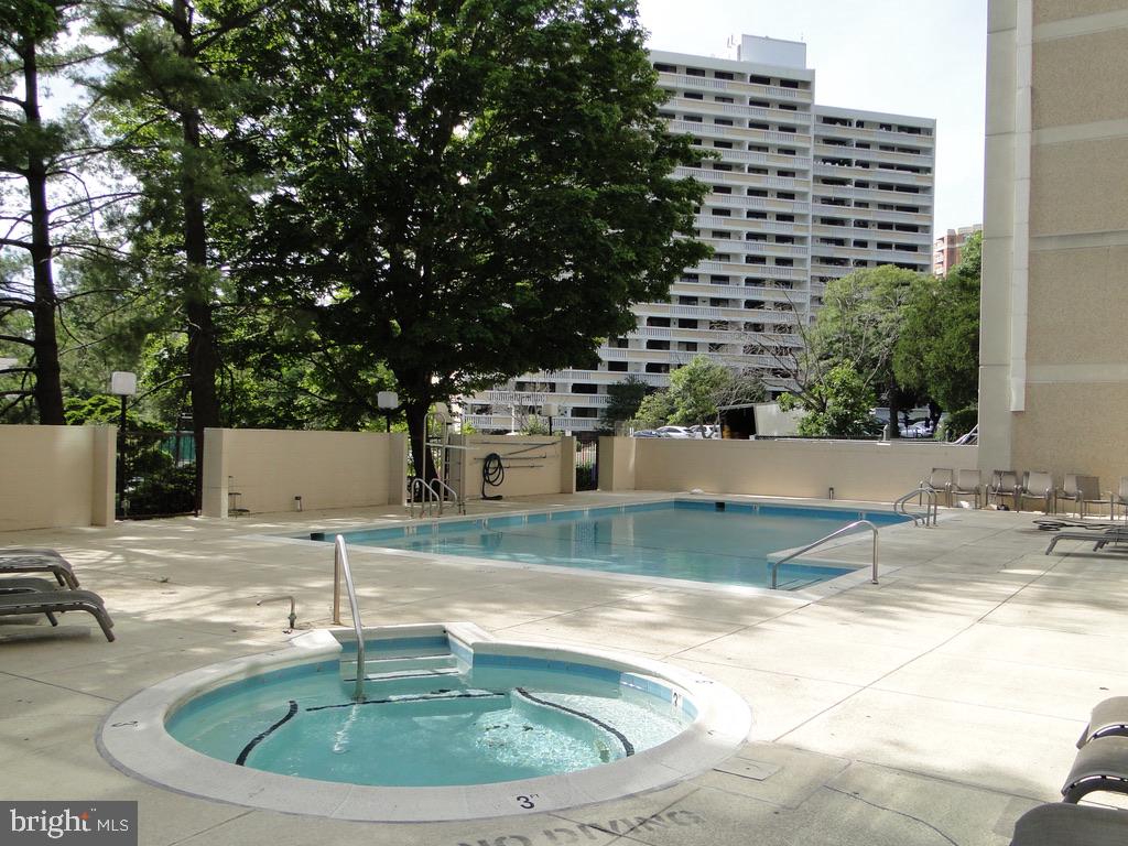 a view of a swimming pool with a sitting space