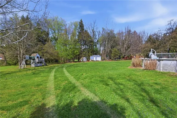 a backyard of a house with lots of green space
