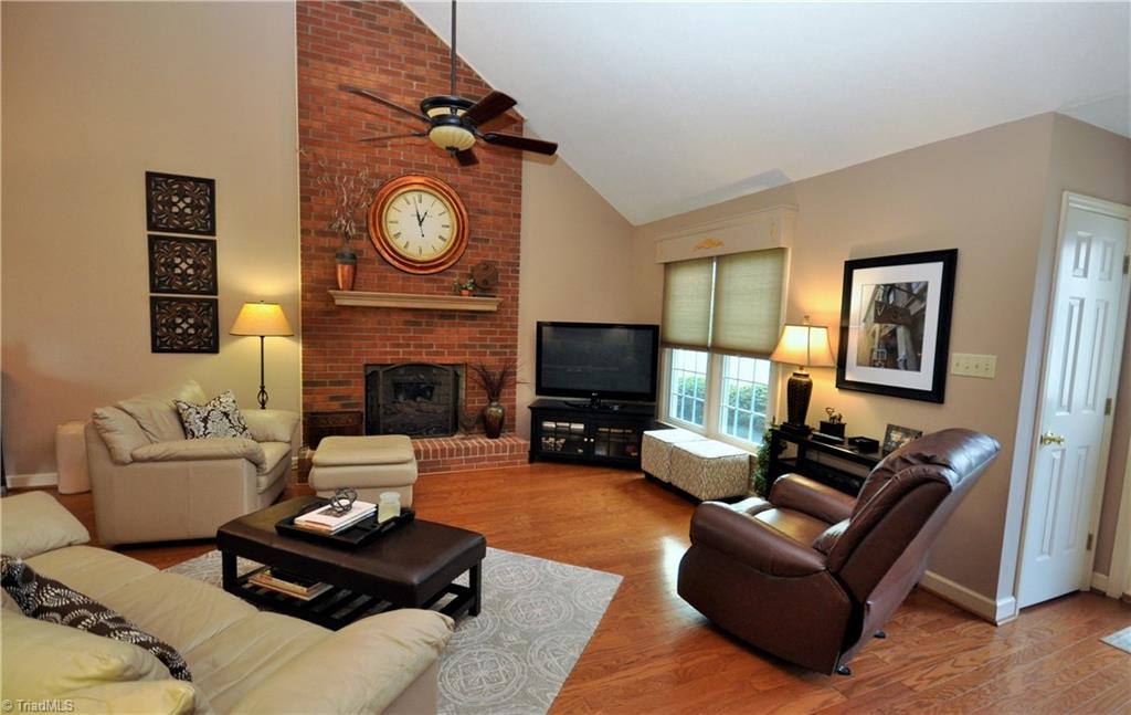 549 Adams Gate Road Winston-Salem, NC 27107 - Photo 2 of 30 Formal living room with gas fireplace and custom window treatments.
