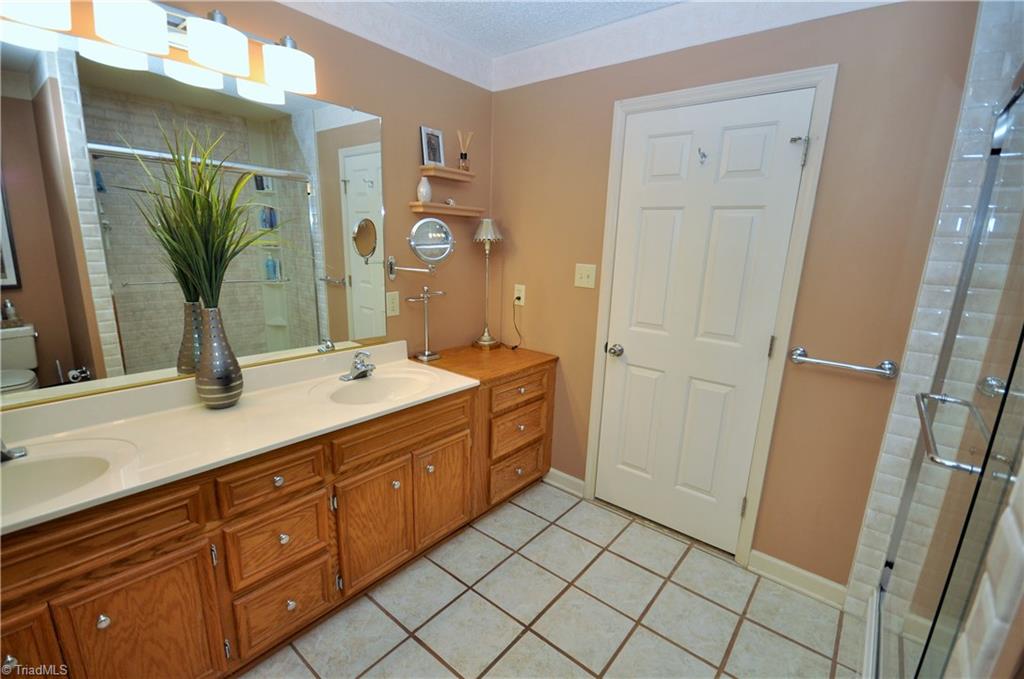 549 Adams Gate Road Winston-Salem, NC 27107 - Photo 14 of 30 Private master bath has dual vanity and a lot of storage and counter space.