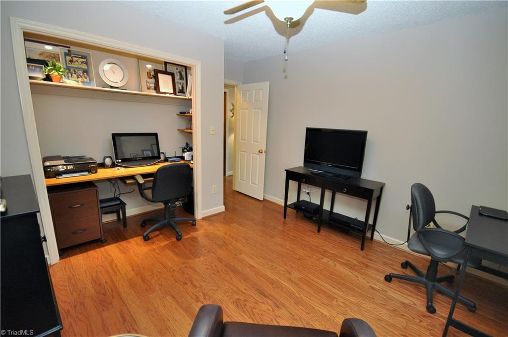 549 Adams Gate Road Winston-Salem, NC 27107 - Photo 16 of 30 2nd bedroom currently being used as office with built in desk. Doors could easily be added back to closet to use this as a traditional bedroom.
