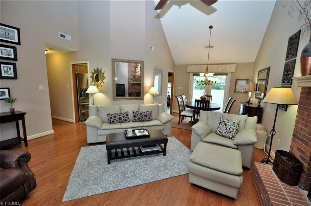 549 Adams Gate Road Winston-Salem, NC 27107 - Photo 3 of 30 Living room has vaulted ceilings and neutral paint.