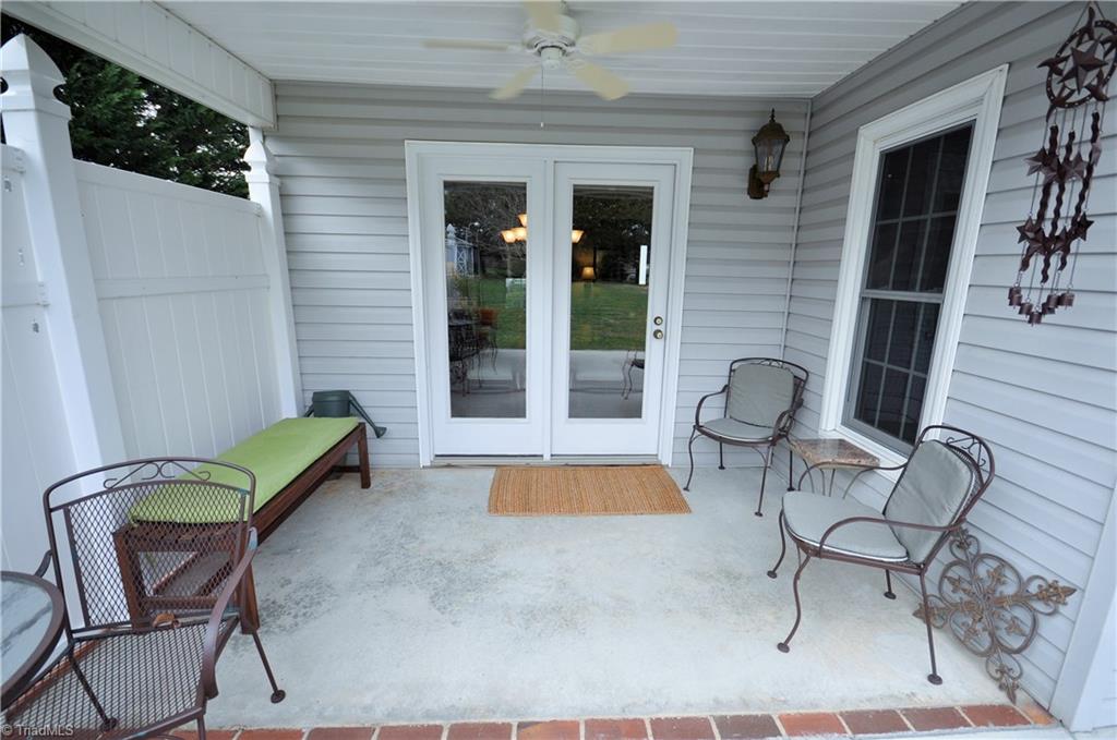549 Adams Gate Road Winston-Salem, NC 27107 - Photo 25 of 30 Private covered patio with ceiling fan.