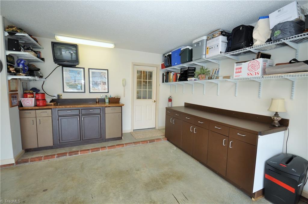549 Adams Gate Road Winston-Salem, NC 27107 - Photo 27 of 30 Garage has great work space and lots of storage.