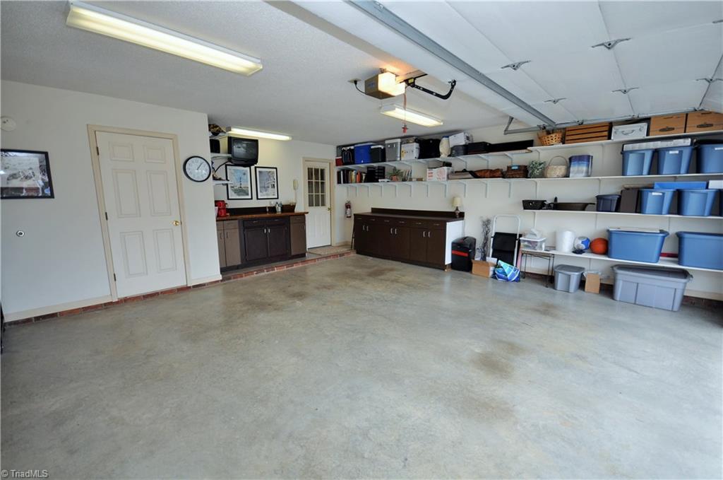 549 Adams Gate Road Winston-Salem, NC 27107 - Photo 28 of 30 Huge 2 car attached garage with storage closet. Super clean.