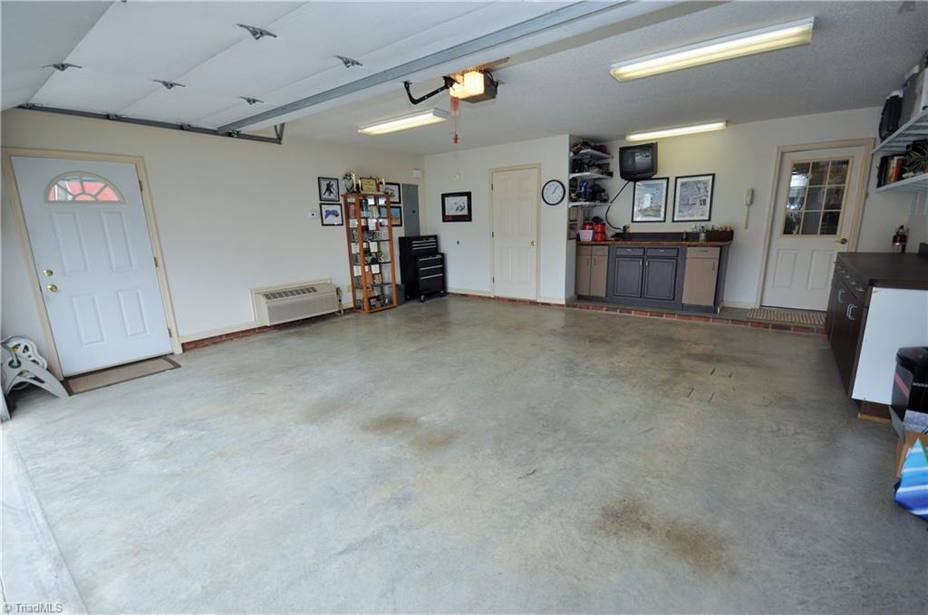 549 Adams Gate Road Winston-Salem, NC 27107 - Photo 29 of 30 Garage has independent wall mounted heat and air unit.