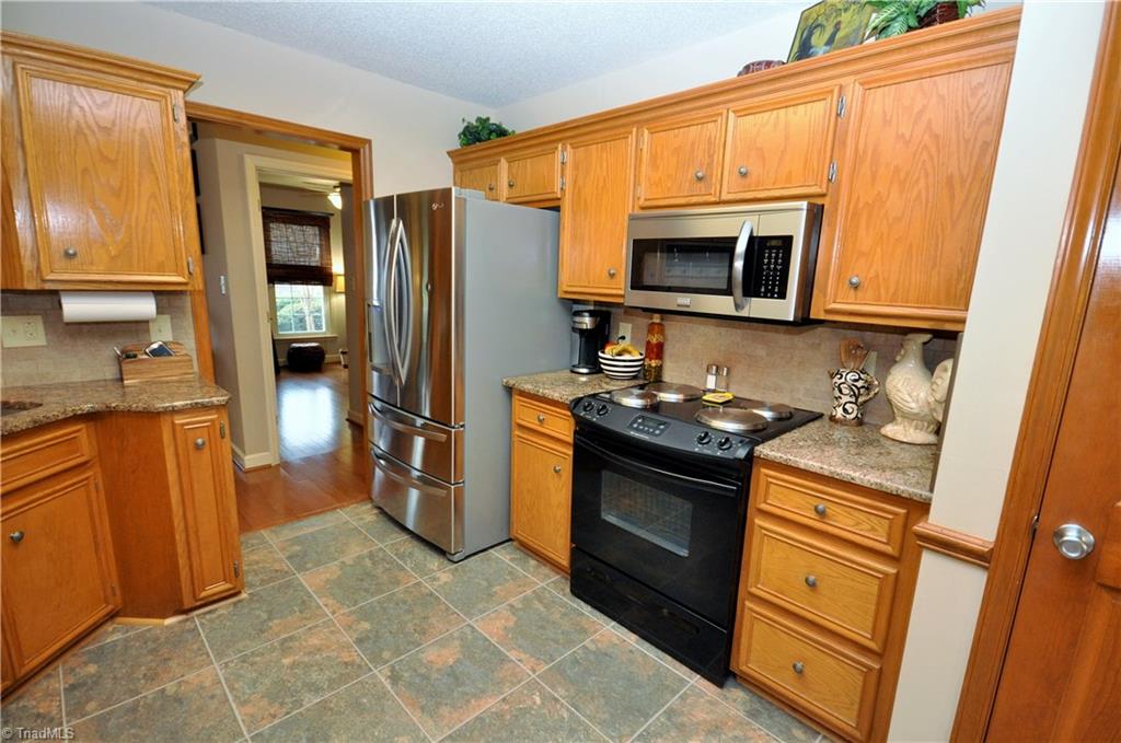 549 Adams Gate Road Winston-Salem, NC 27107 - Photo 6 of 30 Kitchen has built in microwave and pantry.