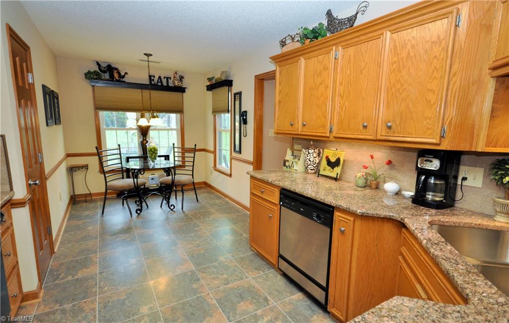 549 Adams Gate Road Winston-Salem, NC 27107 - Photo 8 of 30 Eat in kitchen offers breakfast area with additional custom window treatments.