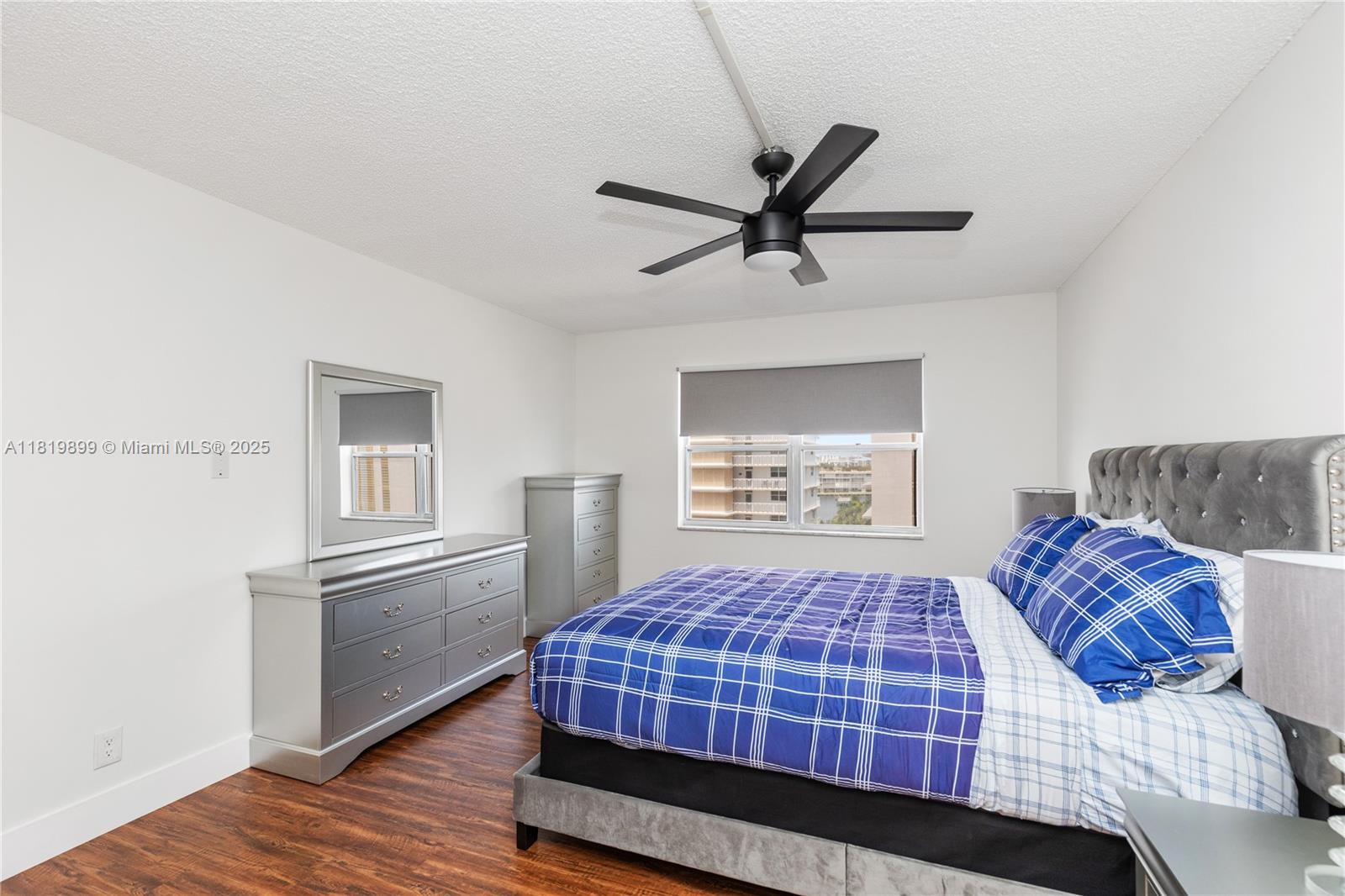 401 Golden Isles Drive, Unit 613 Hallandale Beach, FL 33009 - Photo 23 of 39 a bedroom with a bed and a window