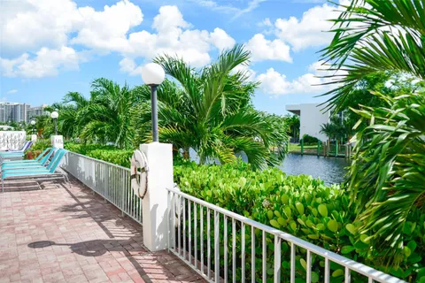 a view of a yard with flower plants