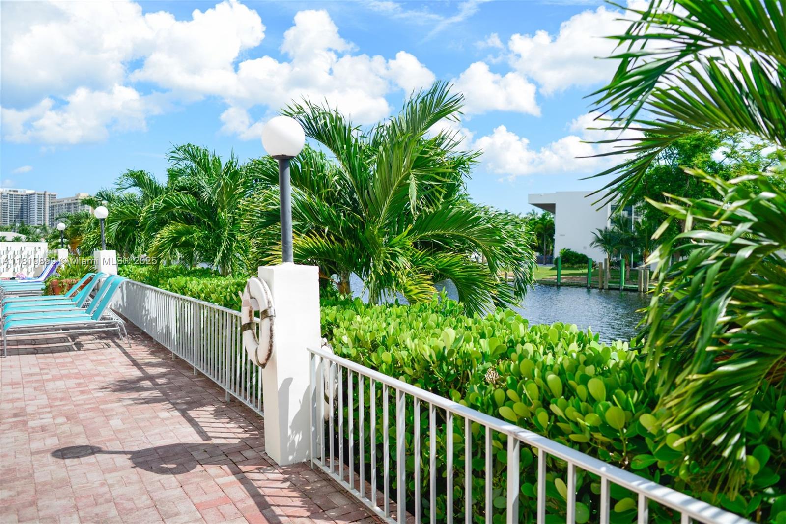 401 Golden Isles Drive, Unit 613 Hallandale Beach, FL 33009 - Photo 3 of 39 a view of a yard with flower plants