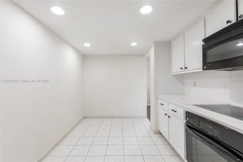 a view of a kitchen with electric appliances