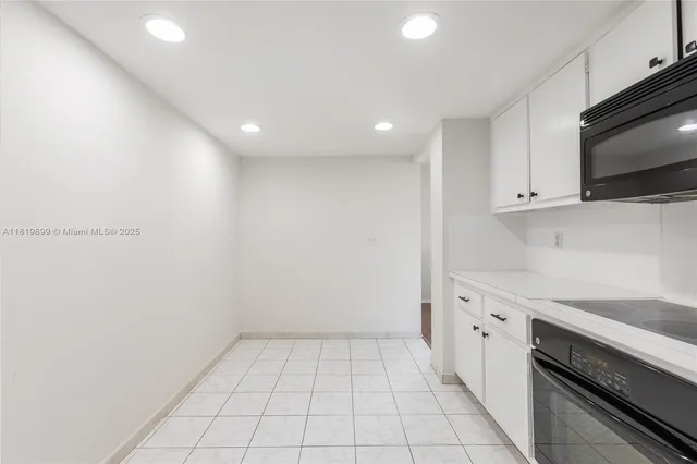 a view of a kitchen with electric appliances