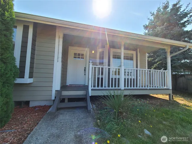 front view of a house with a yard