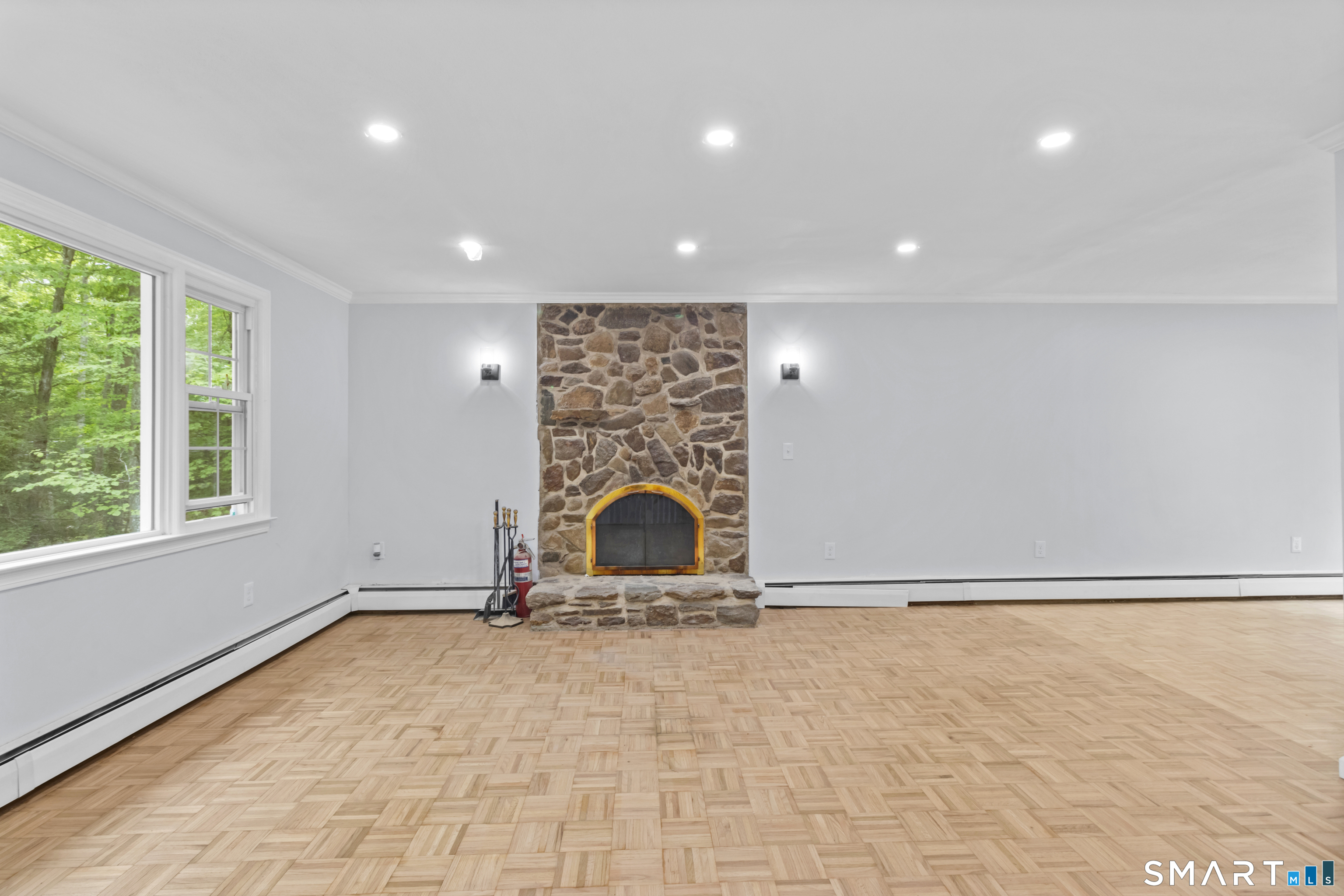 20 Quiet Woods Road East Hampton, CT 06424 - Photo 6 of 40 a view of a room with a fireplace and window