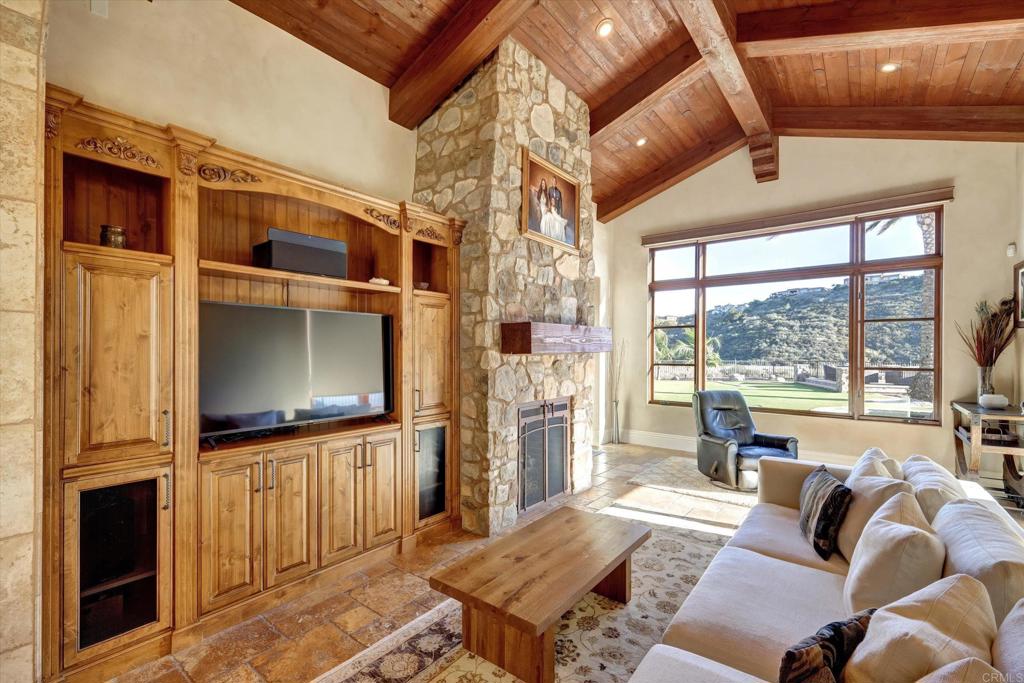 18179 El Brazo Rancho Santa Fe, CA 92067 - Photo 16 of 69 a living room with furniture windows and a flat screen tv