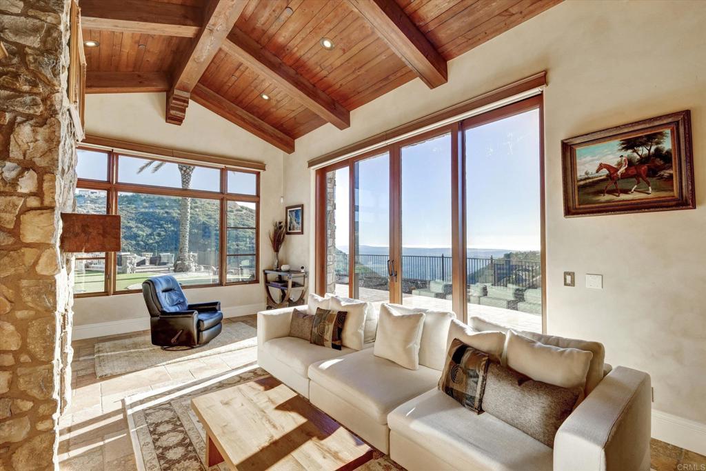 18179 El Brazo Rancho Santa Fe, CA 92067 - Photo 17 of 69 a living room with furniture and large windows