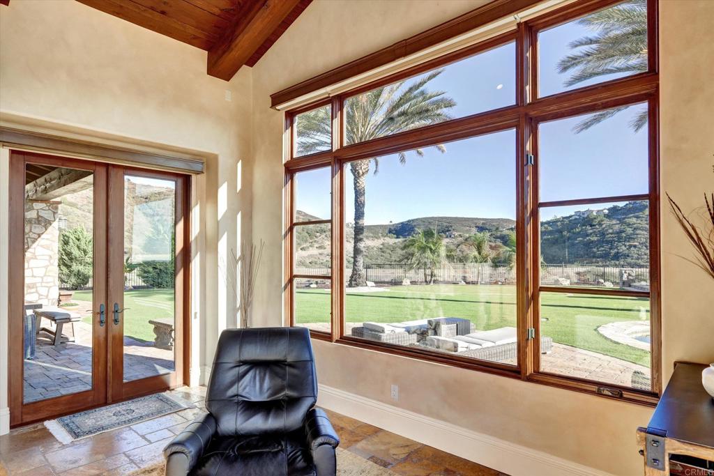 18179 El Brazo Rancho Santa Fe, CA 92067 - Photo 19 of 69 a living room with furniture and floor to ceiling windows