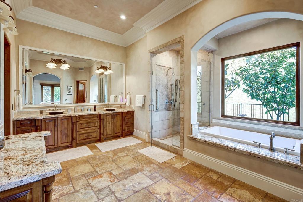 18179 El Brazo Rancho Santa Fe, CA 92067 - Photo 27 of 69 a spacious bathroom with a tub sink shower and mirror