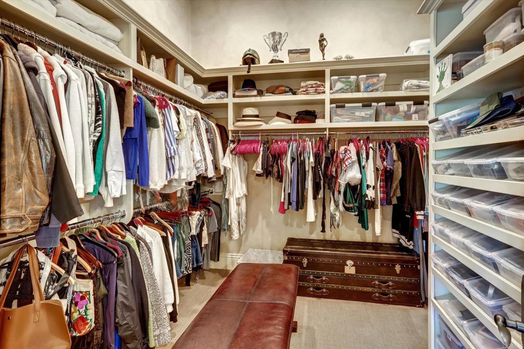18179 El Brazo Rancho Santa Fe, CA 92067 - Photo 29 of 69 a view of walk in closet with clothes and shoes