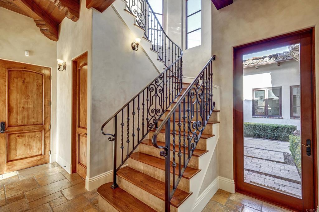 18179 El Brazo Rancho Santa Fe, CA 92067 - Photo 32 of 69 a view of entryway with wooden floor and stairs