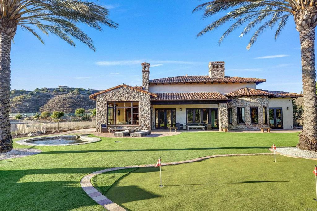 18179 El Brazo Rancho Santa Fe, CA 92067 - Photo 48 of 69 a front view of a house with a garden