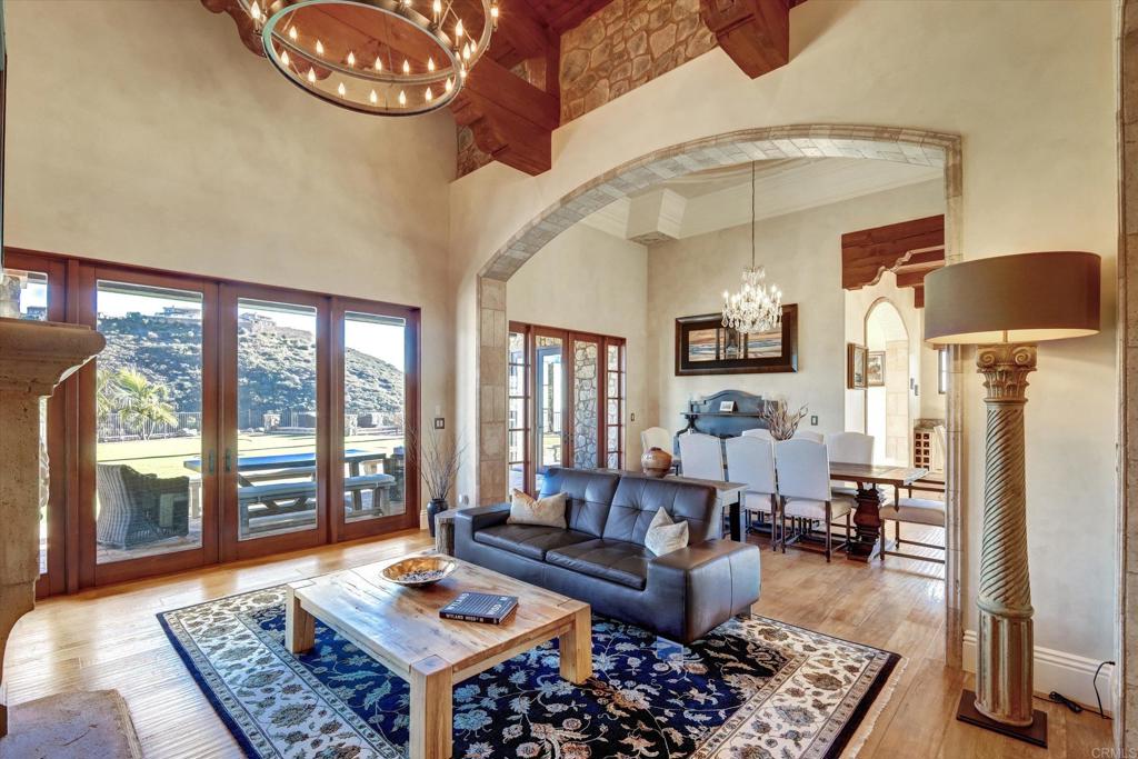 18179 El Brazo Rancho Santa Fe, CA 92067 - Photo 9 of 69 a living room with furniture and a floor to ceiling window