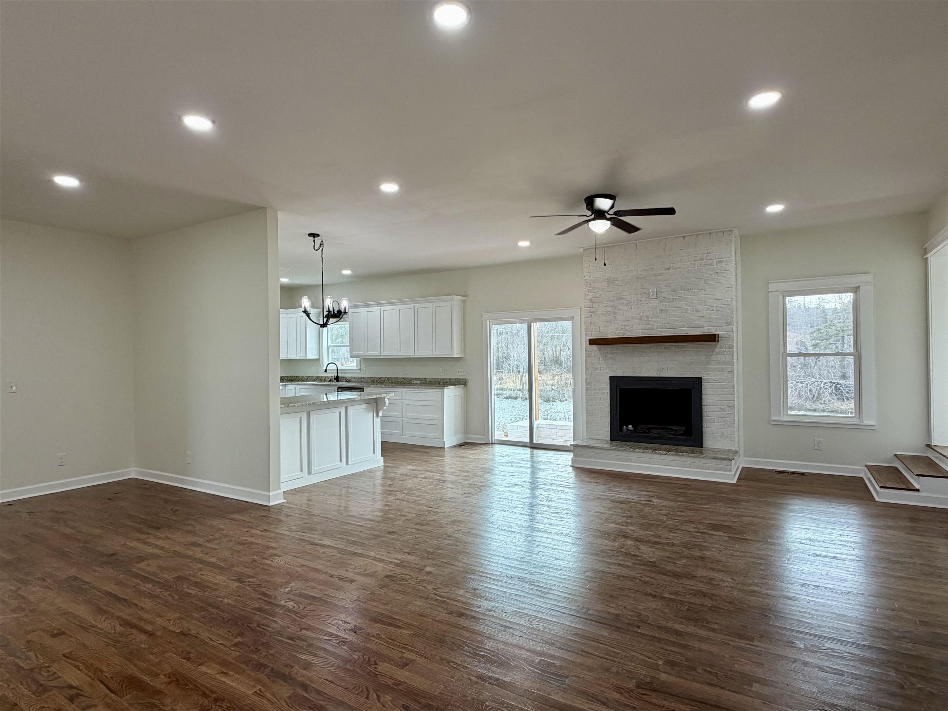 172 New Bethel Road Selmer, TN 38375 - Photo 3 of 30 a view of a kitchen with a sink and a fireplace