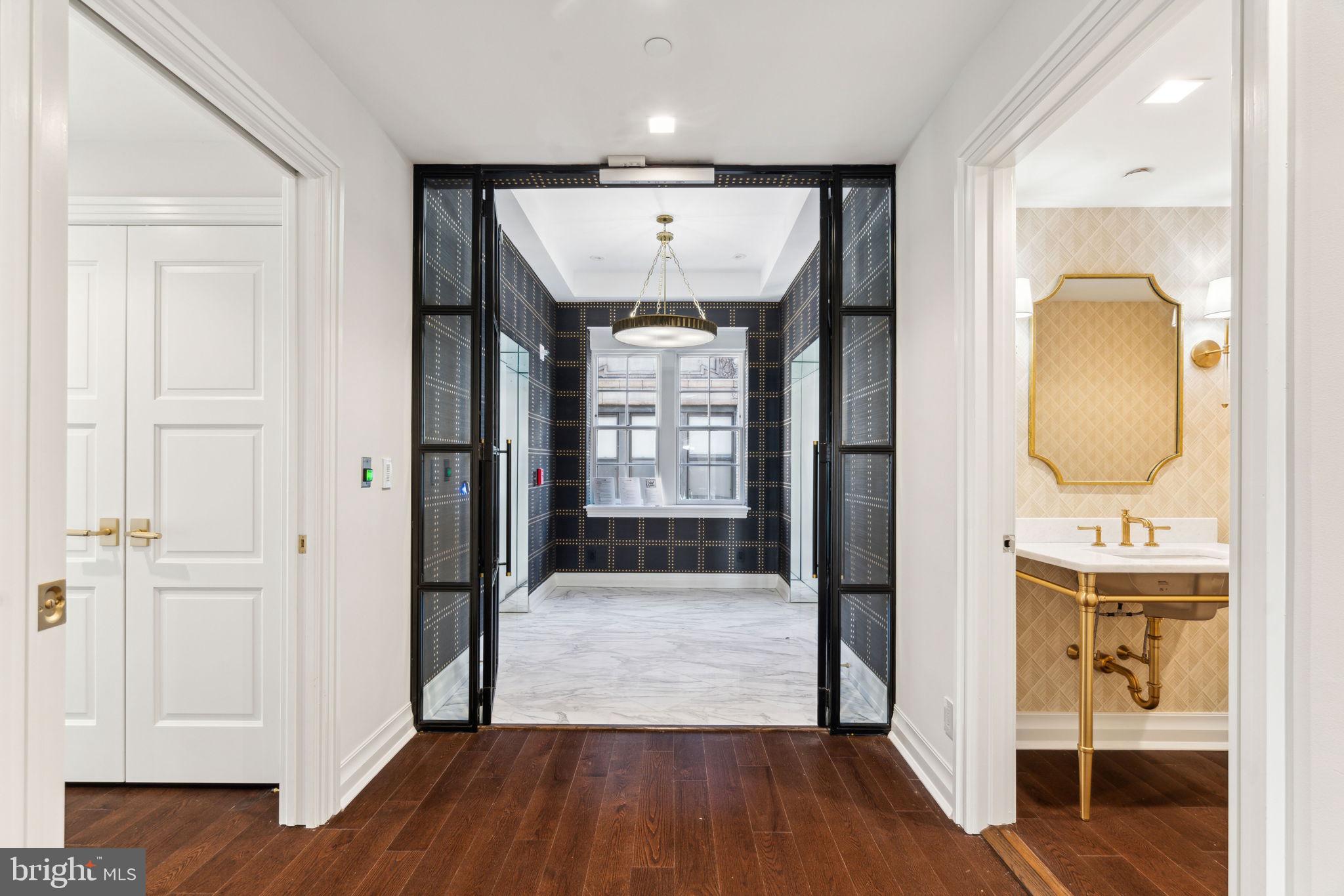 1601 Locust Street, Unit 1300 Philadelphia, PA 19102 - Photo 2 of 45 a view of hallway with wooden floor